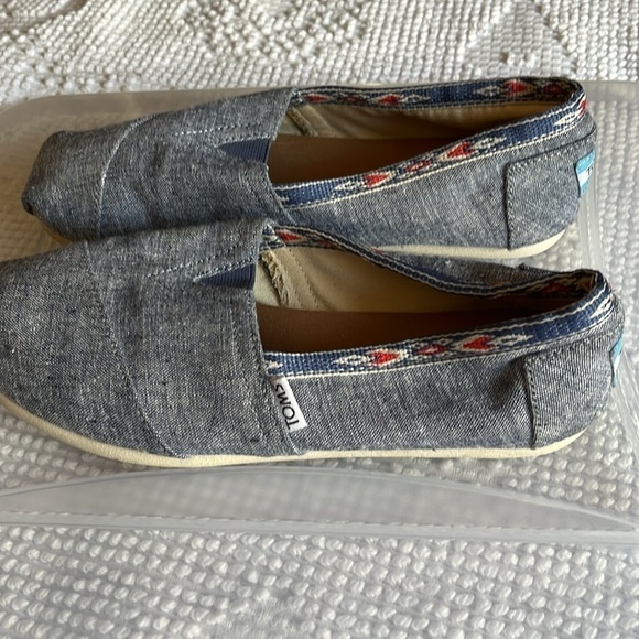 Toms denim look slip ons with navy blue and orange Aztec trim. Size 7 - Picture 3 of 8